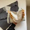 Estilo Chinês Primavera 2026 Nova Bolsa de Mão Casual Grande Capacidade com Corrente de Contas Bolsa de Ombro Bolsa Tote de Braço Bolsa Feminina