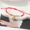 Pulsera de Cuerda Roja con Amuletos de Trébol, Mariposa y Cristales, Pulsera Tejida Ajustable para Parejas y Estudiantes, Joyería de Año de Nacimiento
