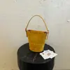 Bolso de hombro tipo cubo casual y sencillo para mujer, nuevo bolso de moda 2026 con textura para llevar al hombro o cruzado, bolso de mano para el trabajo, moderno