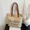 Bolsa feminina casual de grande capacidade 2025 primavera/verão nova bolsa versátil de lona bolsa de ombro para o dia a dia bolsa tote simples