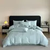 Juego de cuatro piezas de algodón cepillado ultrasuave y amigable con la piel, estilo de lujo ligero de alta gama, funda nórdica suave y simple de jacquard de algodón lavado, funda de almohada