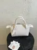 Bolso blanco de estilo minimalista para mujer, bolso de hombro de alta gama para el trabajo, bolso cruzado, bolso tipo dumpling, bolso tote pequeño para el trabajo y artículos varios