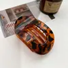 Grampo de cabelo oval plano grande e transfronteiriço novo, elegante, feminino, design criativo em arco, forte aderência, clipe de tubarão