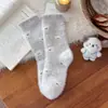 Calcetines de lana australiana para mujer estilo coreano azul lechoso con lazo calcetines de media pantorrilla koala lindo de dibujos animados engrosados cálidos calcetines para dormir