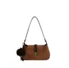 Bolso de axila retro de gamuza nuevo 2026 para mujer, bolso de hombro cruzado de alta gama con colgante de bola de pelo, bolso tote para el día a día