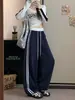 Calça Feminina Listrada de Algodão com Barra Curva Outono Inverno 2026 Nova Patchwork Color Block Casual de Barra Larga Cintura Alta Perna Reta Calça Esportiva
