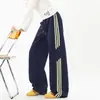 Colección de otoño de estilo americano: diseño a rayas moderno, versátil, corte holgado, pants casuales, pierna recta, pantalones de pierna ancha