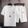Traje de verano para hombre, moderno, versátil, color sólido, casual, camiseta de manga corta Waffe, top, estilo coreano, marca de moda, pantalones capri
