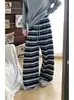 Pantalones anchos de forro polar a rayas negras para mujer de Guang Apparel, nueva colección otoño/invierno 2026, corte relajado, cintura alta, pantalones casuales de pierna recta