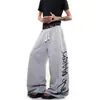 Pantalones de chándal retro americano de calle con estampado de letras en la cintura, paneles, dobladillo curvo, para hombre y mujer, casual deportivo de pierna ancha para primavera y otoño