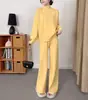 Tejidos de estilo europeo y americano para otoño e invierno: nuevo conjunto de dos piezas para mujer: suéter grueso de cuello medio alto y pantalones de pierna ancha de color liso