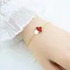 Pulseira Cruzada Europeia e Americana de Aço Inoxidável Trevo da Sorte de Quatro Folhas Flor Única Dupla Face Não Desbota Pulseira Versátil