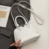 Design de Nicho Novo Transfronteiriço Bolsa Shell Portátil Fashion para Mulheres, Versátil para o Dia a Dia Estilo Garota Quente Casual Texturizada Bolsa Transversal