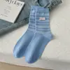 Atacado da Indústria de Meias Zhuji Outono Inverno Estilo Coreano Meias de Cano Médio Color Block Etiqueta de Tecido Meias Listradas Empilhadas Soltas Meias Casuais de Algodão Puro Femininas
