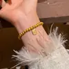Pulsera de cuentas con colgante de amuleto de moneda estilo chino nuevo, sensación vintage de nicho de alta gama, accesorio de mano moderno y simple