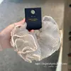 Selección PremiumElásticos elegantes y con estilo, nueva colección de accesorios para el cabello de nicho de alta gama para recoger el cabello en la parte posterior de la cabeza