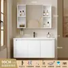 Tocador de baño engrosado y ahorrador de espacio con diseño en color crema, que cuenta con un lavabo redondeado, lavabo cerámico integrado y un lavabo de una sola pieza.