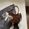 Nova Bolsa de Mão de Alto Estilo Única para o Verão de 2026, Bolsa de Ombro Fashion, Bolsa Saco Casual Relaxada de Cor Sólida, Tendência
