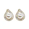 Pendientes de gota estilo retro de Hong Kong de Cao Shi con incrustaciones completas de diamantes, circonitas microincrustadas y perlas artificiales, un accesorio delicado con un toque de lujo