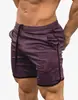 Amazon shorts de verão masculinos de secagem rápida cor sólida esportivos fitness calças de cinco pontos calças de praia fabricantes atacado