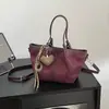 Bolso de mano de gamuza con diseño retro para mujer, nuevo modelo 2026, único y fuera de lo común, adecuado como bolsa de mano para el uso diario.