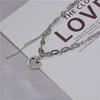 Collar de acero de titanio con colgante de corazón de estilo frío versátil de Niche para mujer 2021, accesorios de cadena de clavícula populares de estilo frío retro.