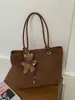 Bolso de mano tejido de alta gama retro transfronterizo, bolso de hombro simple casual moderno, bolso de axila de gran capacidad para ir al trabajo