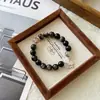 Danza de Mariposas en la GalaxiaPulsera de Cristal Súper Siete Negro DoradoObsidiana Plateada NaturalCuentas Fantasma BlancasPulsera de Estilo Chino Nuevo para Mujer
