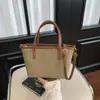 Bolso bandolera tipo cubo 2026 nuevo verano transpirable tejido a mano bolso de hombro color block retro estilo coreano bolso de mujer