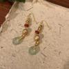 Marea nacional piedra natural jadeíta método antiguo arena oro aretes borla nuevo chino antiguo dorado agua gota larga para la oreja
