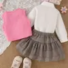 Conjunto de tres piezas para niñas de primavera y otoño, nuevo chaleco de punto + camisa blanca de manga larga + falda corta a cuadros, estilo preppy