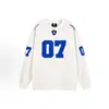 Conjunto de estilo esportivo retrô americano, camiseta branca de manga longa para mulheres, top moderno de caimento solto, novidade primavera 2026