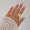 Anillo de metal liso con textura femenina, forma de gota de agua, abierto, con forma de huevo, para Europa y Estados Unidos.