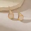 Pendientes de fábrica transfronterizos estilo retro lágrima piedra ojo de gato, lujo ligero, alta gama, diseño de nicho, pendientes, tachuelas, al por mayor en stock