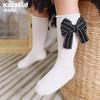 Calcetines de otoño e invierno para niños con lazo de color sólido rojo año nuevo calcetines de tubo calcetines de algodón de viento de princesa para niñas calcetines de baile al por mayor