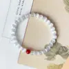 Pulsera deabalorios redondos de dos círculos Arena Púrpura Dorada Alto Contenido Pulsera de un solo círculo Imitación Vidriada Ojo de Gato Cinnabar Rojo Al por Mayor