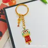 Llavero Colgante Año Nuevo 2026 Metal Zodiaco León Dorado Petardo Despertar Bolsa de la Fortuna Colgante Evento Pequeño Regalo