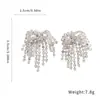 Aretes de borla de fuegos artificiales con incrustaciones de diamantes y aguja de plata, súper etéreos y deslumbrantemente hermosos, lujo ligero con un toque de alta gama, aretes versátiles para mujer, venta al por mayor