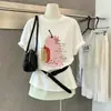 Verano Nuevo Algodón Estilo Coreano Versátil Estampado de Dibujos Animados Holgado Reductor de Edad Oculta Barriga Manga Corta Hombro Normal Camiseta Top Mujer
