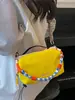 Bolso pequeño ligero y versátil de tela de nailon para mujer, nuevo bolso cruzado casual 2026, bolso para teléfono móvil exquisito y súper popular, bolso de mano pequeño