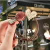 Anillo para el cabello de perlas amorosas Puerta Este Accesorios para el cabello coreanos Fabricantes de tocados Venta al por mayor Sencillo Goma para el cabello roja de internet