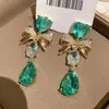 Aretes de Gema Azul Océano Endurecida al Hielo Forma de Gota de Agua Lazo Corazón Estilo Dulce Aretes de Circonita Lujo Ligero Aretes de Alta Gama para Mujer
