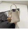 Bolso tipo cubo casual transfronterizo para mujer 2025 nuevo bolso bandolera simple de gran capacidad bolso de hombro sencillo y a la moda para ir al trabajo