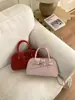 Bolsa de Mão Popular em Formato de Concha Transfronteiriça Novo Modelo 2026 Textura de Alta Qualidade Bolsa de Ombro Versátil Estilosa Bolsa Transversal de Alto Valor