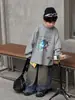 Tai Ru 2026 Outono Novo Camiseta Infantil Estilo Coreano Patchwork de Desenho Animado Manga Longa Moda Masculina Casual Solta