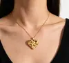 Colgante retro de corazón de acero inoxidable transfronterizo, chapado en oro de 18 quilates, con superficie texturizada en relieve, amuleto con forma de durazno, accesorios al por mayor