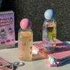 Taza de vidrio de borosilicato alto resistente a altas temperaturas taza láser para niñas alto valor de color taza pequeña portátil para sorber taza de agua fresca de verano
