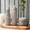 Botella Redonda de Hombro con Tapa Flip-Top de 250 ml para Champú y Gel de Ducha Frasco de 500 ml de Material de Peluche Pe Personalizado para Loción y Mascarilla Capilar