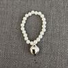 Labubu Burbuja 2ª Generación Mart Corazón Macarrón Fiesta Sentada Colgador de Cara Anillo para el Cabello Pulsera