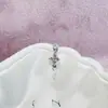 Nuevo Estilo Flor de Trébol de Cuatro Hojas Gota de Agua Borla Colgante Acero de Titanio Médico 316L Pendiente de Hélice Venta Caliente Pendientes Versátiles